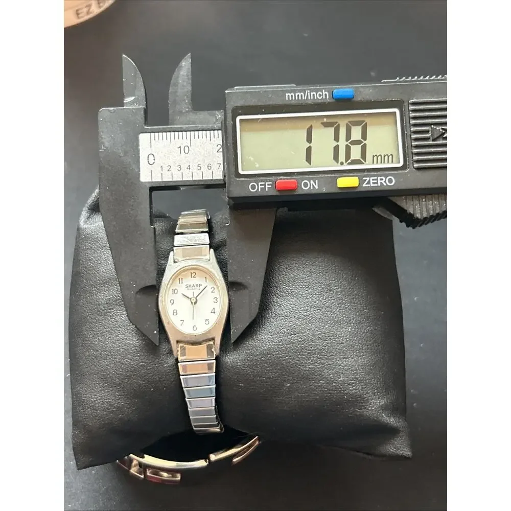 Sharp Silver Tone White Dial Stretch Band Women’s Quartz Watch
